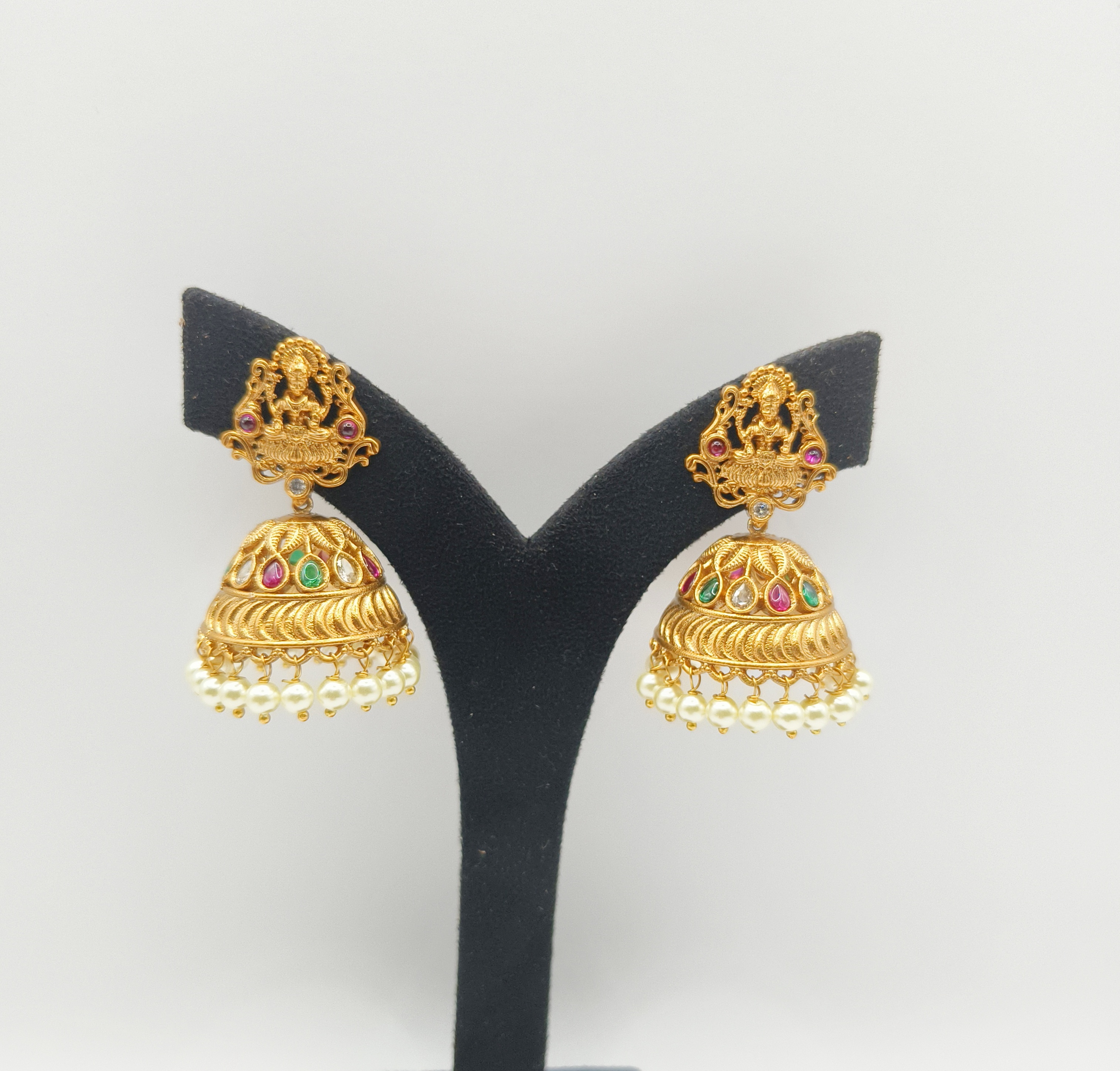 Elegant earring collection featuring studs, hoops, and drops